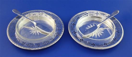 A pair of George V pierced silver butter dishes,